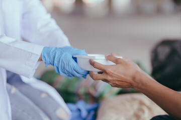 Health workers provide assistance to the homeless. homeless poor people and depression concepts.