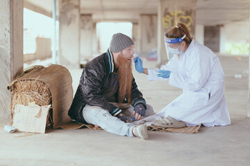 Health workers provide assistance to the homeless. homeless poor people depression Help and hope concept.