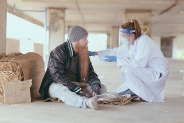 Health workers provide assistance to the homeless. homeless poor people depression Help and hope concept.