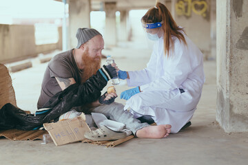 Fototapeta premium Health workers provide assistance to the homeless. homeless poor people depression Help and hope concept.