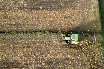 Aerial view of a tractor at the time of winter soil preparation