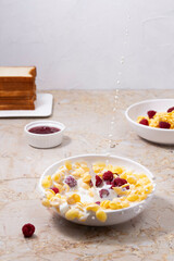 Splash of milk in cereal bowl