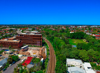 Panoramic Aerial Drone view of Suburban Sydney housing, roof tops, the streets and the parks