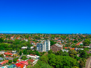 Panoramic Aerial Drone view of Suburban Sydney housing, roof tops, the streets and the parks