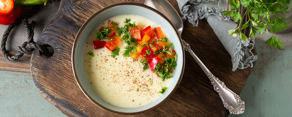 bowl of creamy leek and potato soup on the table
