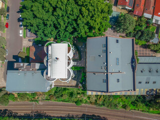 Panoramic Aerial Drone view of Suburban Sydney housing, roof tops, the streets and the parks