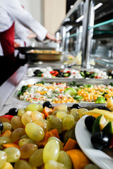 buffet table served with different canapes, salads, and dishes  snacks ready for eating in a restaurant