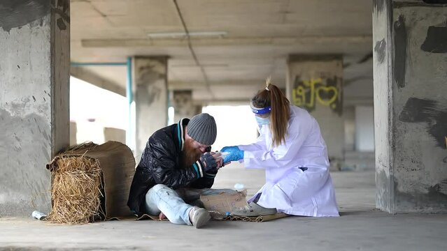 Health workers provide assistance to the homeless. homeless poor people depression Help and hope concept.