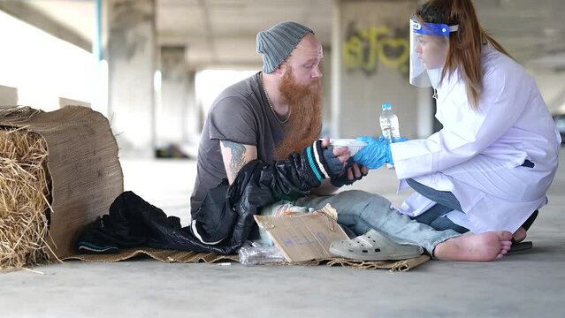 Health workers provide assistance to the homeless. homeless poor people depression Help and hope concept.