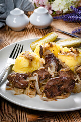 Fried liver with onion.