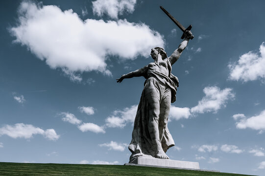 Statue "The Motherland calls" (Rodina-Mat`) on Mamaev Hill in Volgograd, Russia. Blue sky with clouds on background.