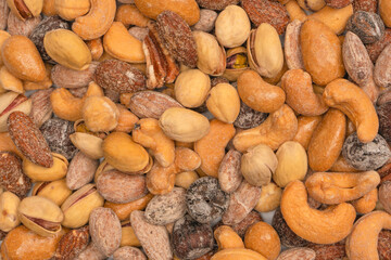  A group of almonds, pistachios, walnuts, macadamia, cashews.