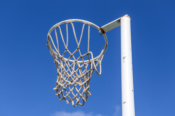 netball hoop against blue sky © Veronica