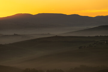 Scenic view of the sunrise in Toscana, Italy. Golden sunrise light in Toscana.