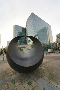 Brussels, Brabant, Belgium 10 28 2022 : wide anlge view on the modern financial Fortis bank Headquarter Offices from behind an artwork