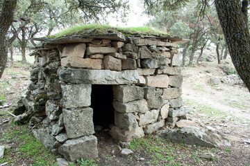 booth or shack where the granite stonemasons stored the work tools. Stone quarry - obrazy, fototapety, plakaty