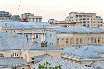 Gray roofs of city houses, top view.