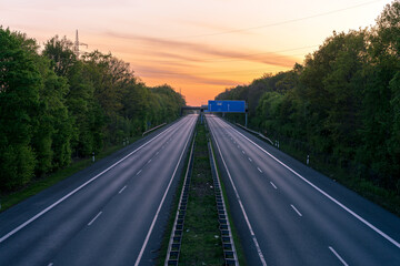 empty highway road in the sunset