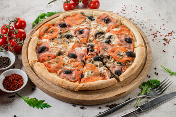 Fresh hot meat pizza on the white concrete background. Flat lay
