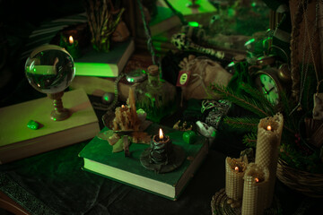 Illustration of magical stuff....candle light, book of spells, magical atmosphere, wizards school, green aesthetic, Halloween time