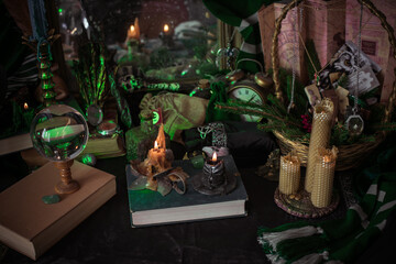 Illustration of magical stuff....candle light, book of spells, magical atmosphere, wizards school, green aesthetic, Halloween time