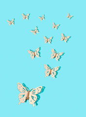 Photo of butterfly pattern isolated on blue background. Minimal concept of love, nature, thanksgiving. Copy space. Flat lay.
