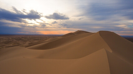Fototapeta na wymiar Sunset sky over Gobi desert dunes in Mongolia