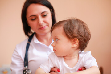 pediatrician examining a little boy. Child at the doctor