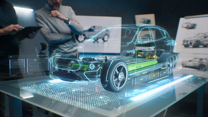 Car design engineers using holographic app in digital tablet. Develop modern innovative high-tech...