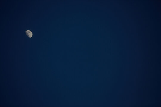 Moon shot from Earth Midnight Blue Sky