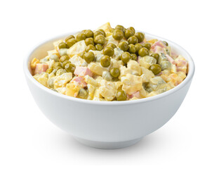 Olivier salad with vegetables and peas is isolated on a white background. Side view, close-up.