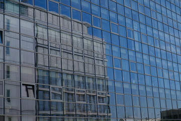 Fototapeta na wymiar modern office building with windows and reflection