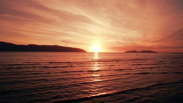 Orange sunset over the ocean, aerial view, drone perspective in Vlora, Albania