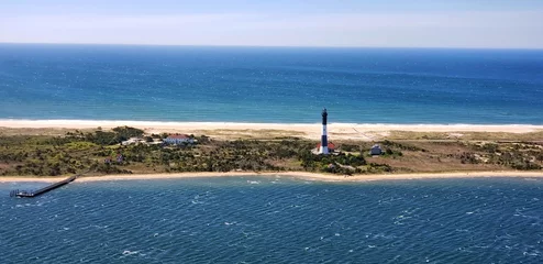  The Fire Island Lighthouse is a visible landmark on the Great South Bay, in southern Suffolk County, New York on the western end of Fire Island, a barrier island off the coast of Long Island © ss