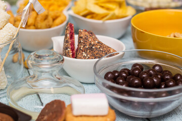 Salty and sweet snacks. Table of salty and sweet snacks. Large group of unhealthy food