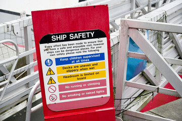 Ship safety sign at gate for passengers boarding