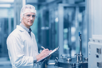 Naklejka na ściany i meble portrait medicine factory scientist worker work in Laboratory Plants Process. medical doctor working research in pharmaceutical industry looking smile.
