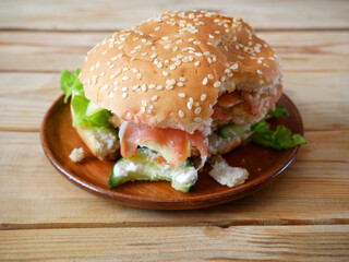 one tasty burgers with meat  burger on plane on wooden background