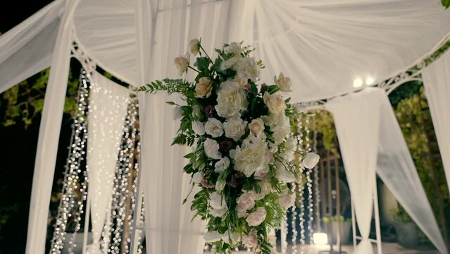 White flowers on the chuppah.