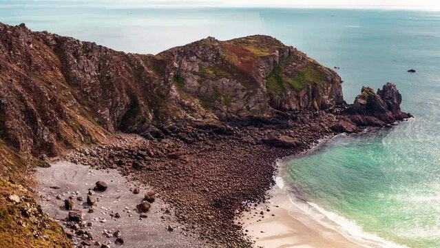 Cinemagraph of rocky beach and blue ocean
