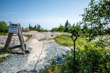 Waters edge of Jordan Pond in Acadia National Park, Maine, USA with fog setting into the distance 