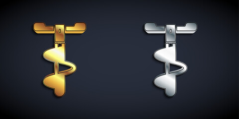 Gold and silver Hand ice drill for winter fishing icon isolated on black background. Long shadow style. Vector