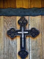 old wooden door with cross