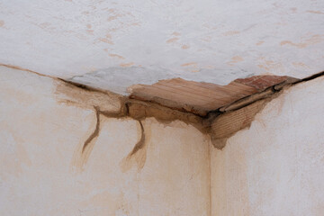 Interior prepared for reconstruction on Ruined old wall corner. Working Fixing Repair Aged...