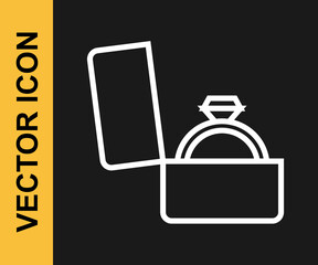 White line Diamond engagement ring in a box icon isolated on black background. Vector