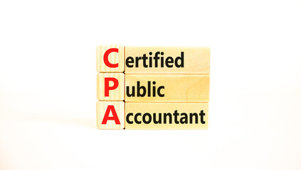 CPA certified public accountant symbol. Concept words CPA certified public accountant on wooden blocks on a beautiful white background. Business and CPA certified public accountant concept. Copy space