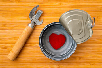 Can opener and tin box with a small red heart
