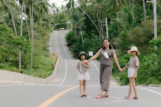 My family walking on beautiful Road Khanom Sichon Road 