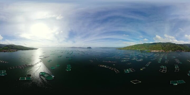Aerial drone of Fish farm on the lake. Fishing industry in the Philippines. 360 panorama. Lake Taal, Tagaytay. Philippines, Luzon.
