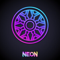 Glowing neon line Alloy wheel for car icon isolated on black background. Vector